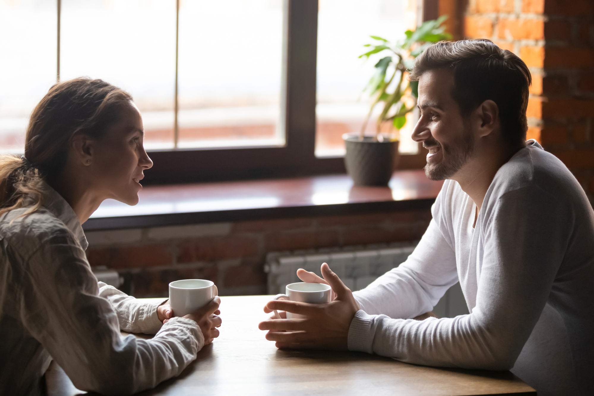 AdobeStock_264723206 Couple communicating over coffee